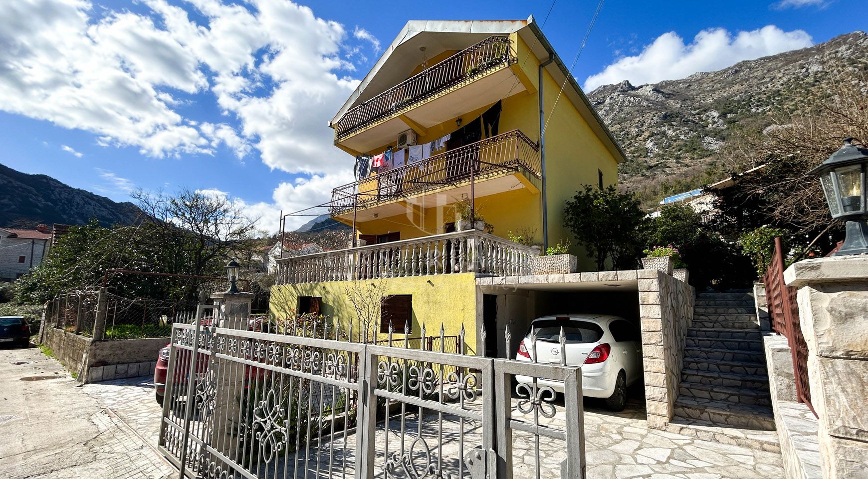 Cozy three-story house with a plot